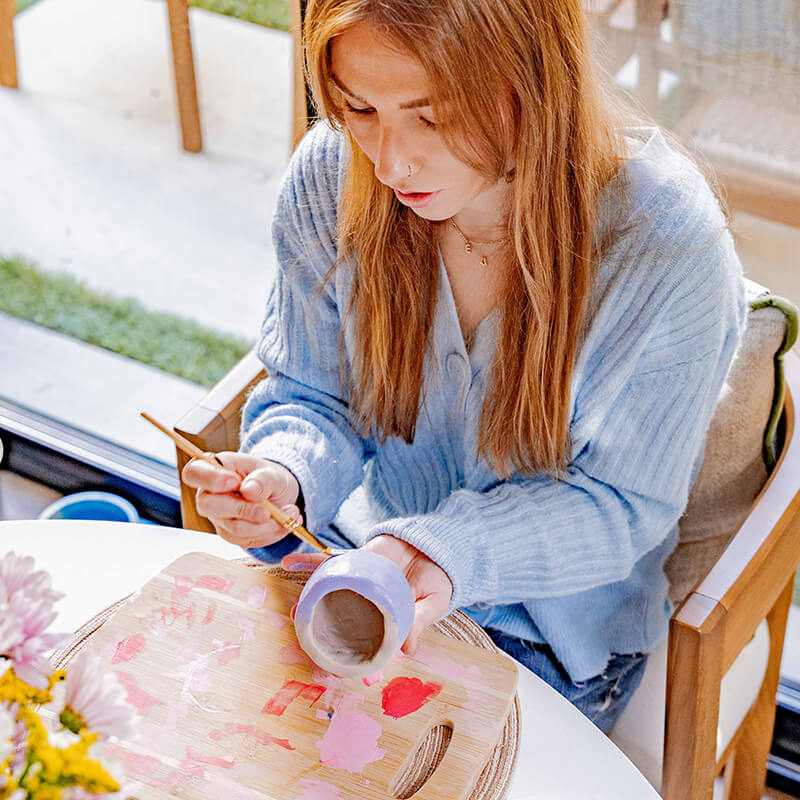 A woman candle making creation