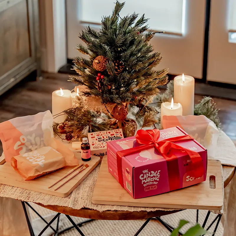 Sculpd Candle Making Kit Packaging in a cozy and Christmas setting